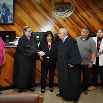 Pro-Tem Judge Smith congratulates Judge Ulloa